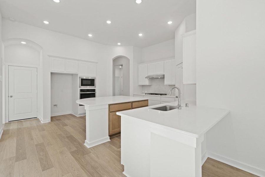 Furnished interior view inside a new home in Sunterra, Katy (Image 16).