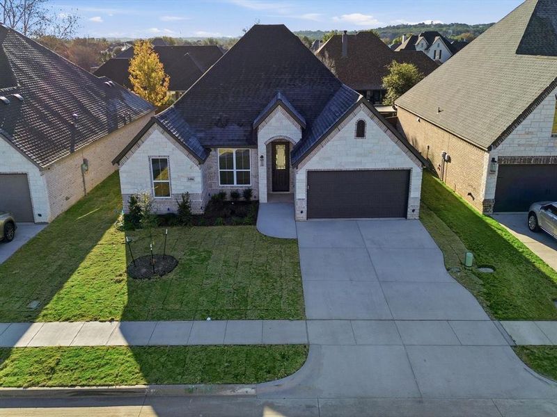 Front exterior of a new home in , Granbury, TX, highlighting curb appeal (Image 26). Front exterior of a new home in , Granbury, TX, highlighting curb appeal (Image 26).