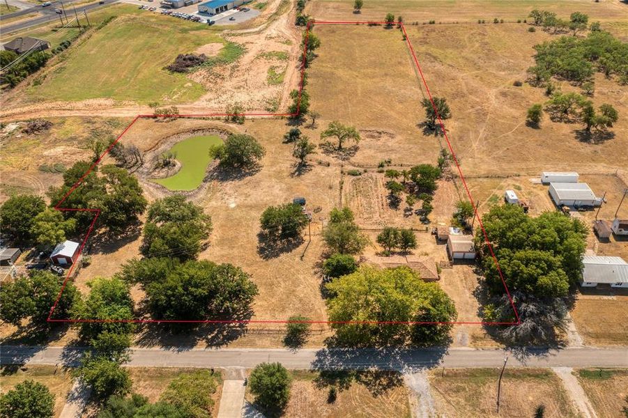 Aerial View of Acreage, Home, and Tank