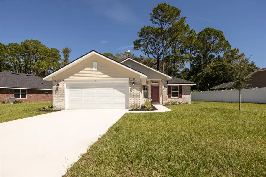 Front exterior of a new home in Palm Coast, Palm Coast, FL, highlighting curb appeal (Image 1). Front exterior of a new home in Palm Coast, Palm Coast, FL, highlighting curb appeal (Image 1).