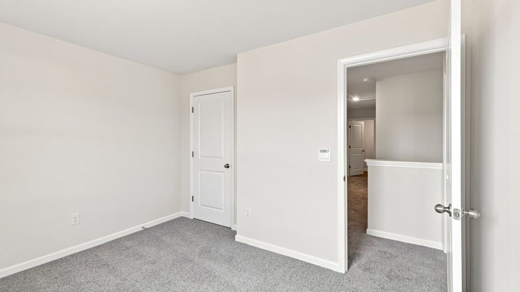 Spacious, unfurnished interior of a new home in Bentley Park, Greenwood (Image 26).