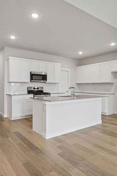 Kitchen in the Masters home plan by Trophy Signature Homes – REPRESENTATIVE PHOTO Kitchen in the Masters home plan by Trophy Signature Homes – REPRESENTATIVE PHOTO