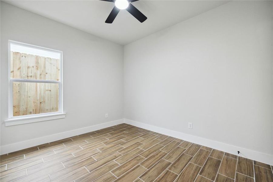 Empty room featuring ceiling fan