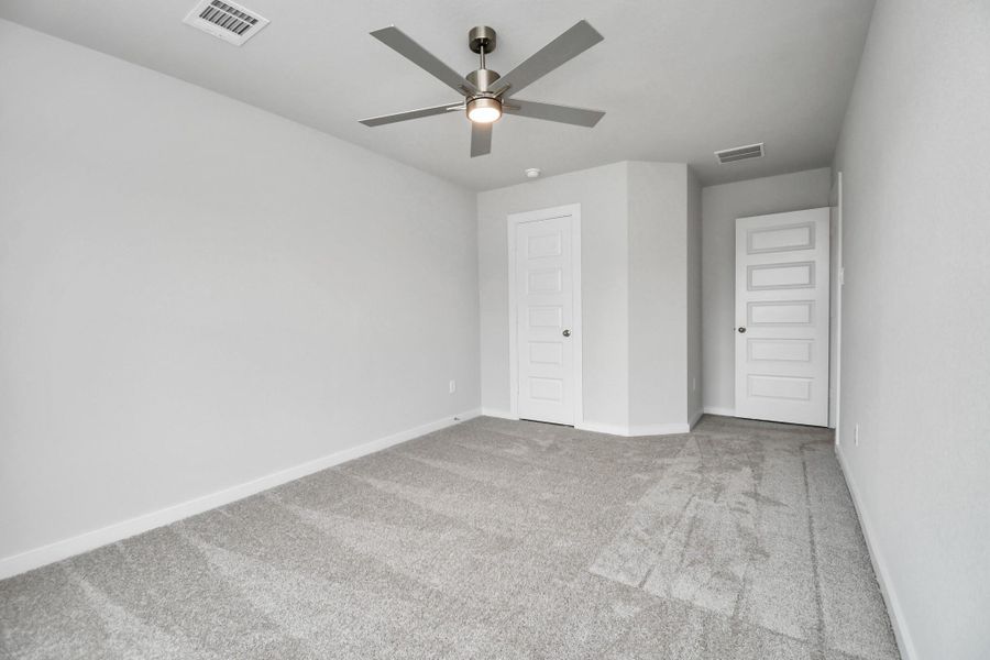 Generously sized secondary bedrooms featuring spacious closets, soft and inviting carpeting underfoot, large windows allowing plenty of natural light, and the added touch of privacy blinds for your personal retreat. Sample photo of completed home with similar floor plan. Actual colors and selections may vary. Generously sized secondary bedrooms featuring spacious closets, soft and inviting carpeting underfoot, large windows allowing plenty of natural light, and the added touch of privacy blinds for your personal retreat. Sample photo of completed home with similar floor plan. Actual colors and selections may vary.