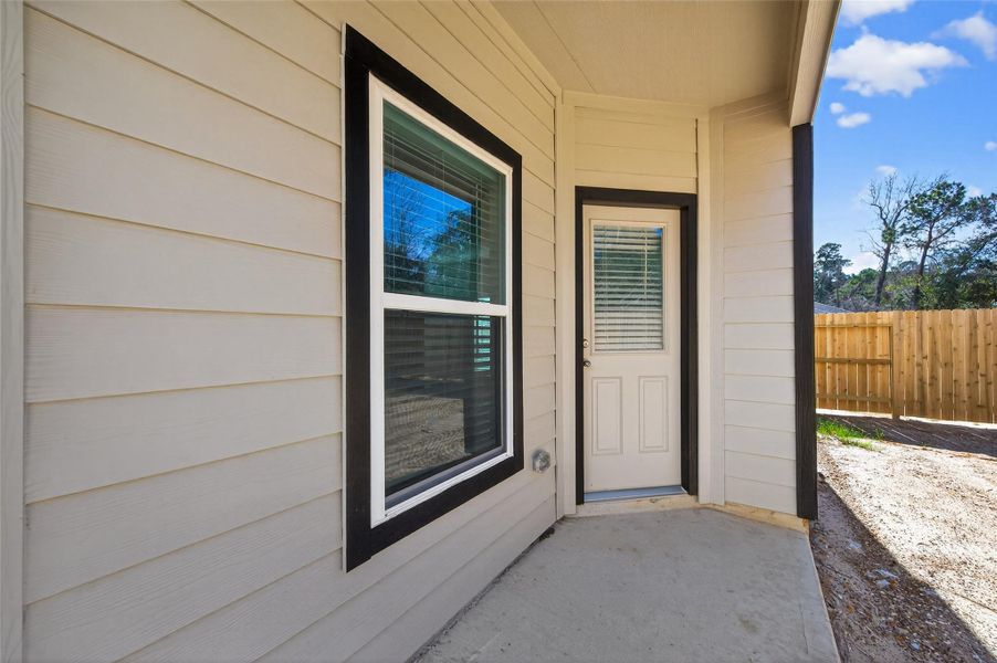 Exterior details and patio area of a home in Enclave at Willis, Willis (Image 3).