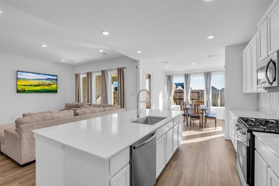 Kitchen Anchored by the Island: A spacious quartz island becomes the heart of the home, offering room to prep, gather, and connect. Open flow to the living and dining areas keeps everything effortless and inviting. Kitchen Anchored by the Island: A spacious quartz island becomes the heart of the home, offering room to prep, gather, and connect. Open flow to the living and dining areas keeps everything effortless and inviting.