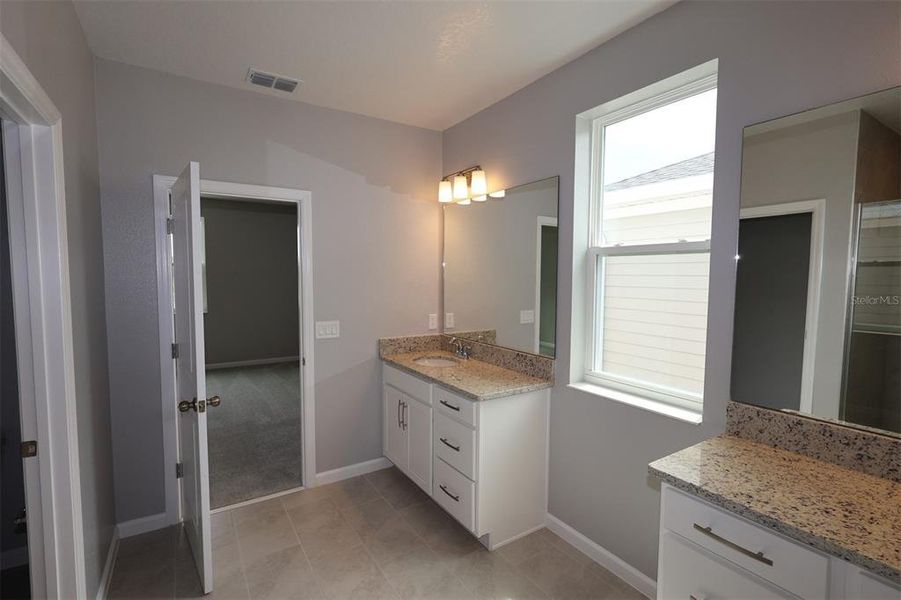 Furnished interior view inside a new home in Center Lake on the Park, St. Cloud (Image 9).