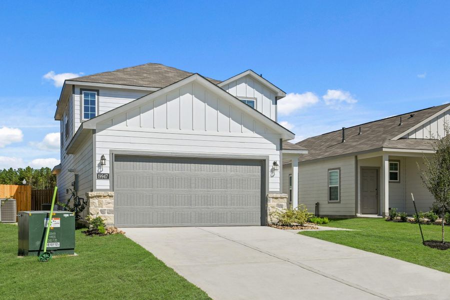 Front exterior of a new home in Northpark South, Porter, TX, highlighting curb appeal (Image 2). Front exterior of a new home in Northpark South, Porter, TX, highlighting curb appeal (Image 2).