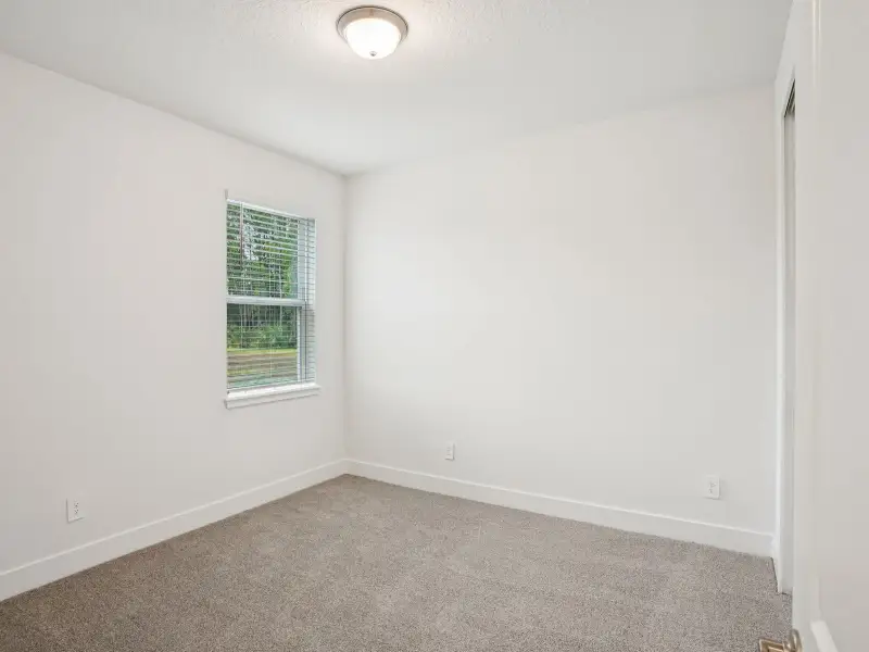 Spacious, unfurnished interior of a new home in Ridgehaven - Signature Series, Ormond Beach (Image 13).