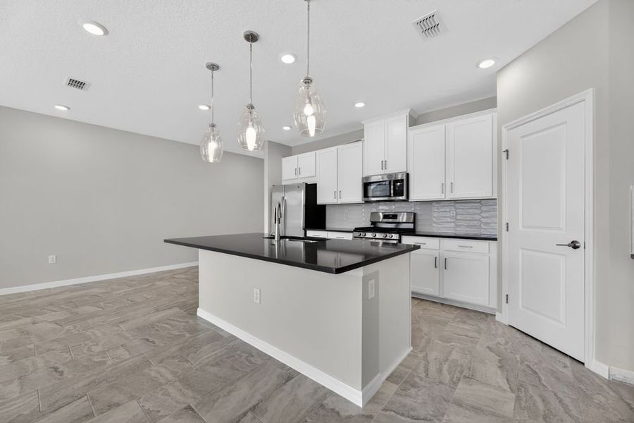 Representative furnished interior of a home built from the Bellflower by Taylor Morrison in Cherry Elm at SilverLeaf, St. Augustine (Image 8).