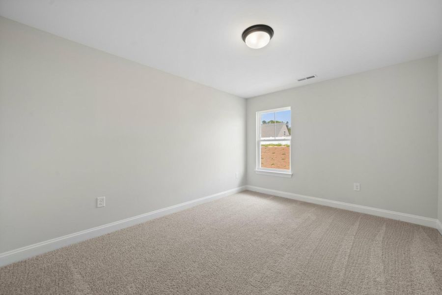 Spacious, unfurnished interior of a new home in Cottages at Piper Village, Trinity (Image 30).