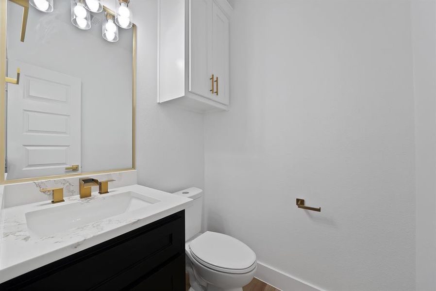 Bathroom featuring vanity and toilet