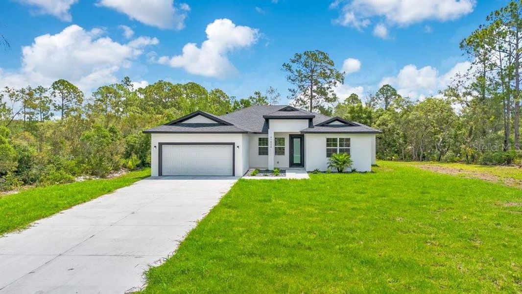 Front exterior of a new home in , Eustis, FL, highlighting curb appeal (Image 20).