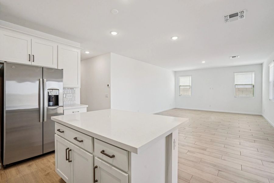 Kitchen and great room. Not actual home, finishes and options may vary.