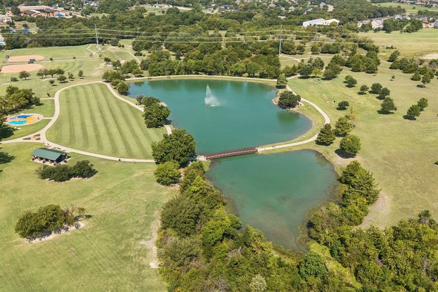Aerial view of a tree filled landscape and a nearby body of water Aerial view of a tree filled landscape and a nearby body of water