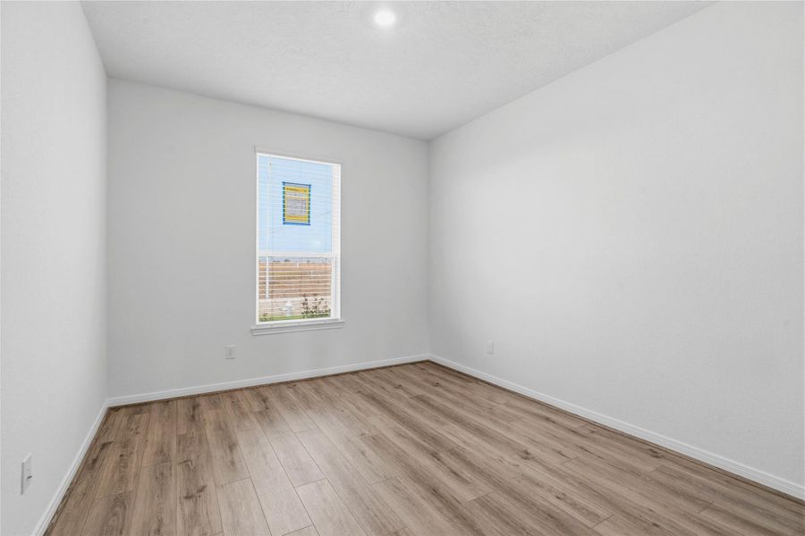 Located at the front of the home is this versatile Den which features great natural light and offers the perfect flexible footprint for a dedicated home office, a quiet reading room, or an intimate formal living space.