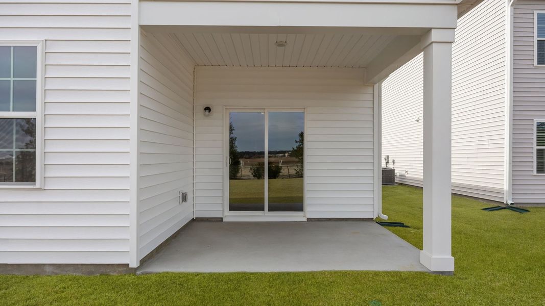 Exterior details and patio area of a home in Ridgewood Farms, Winterville (Image 19).