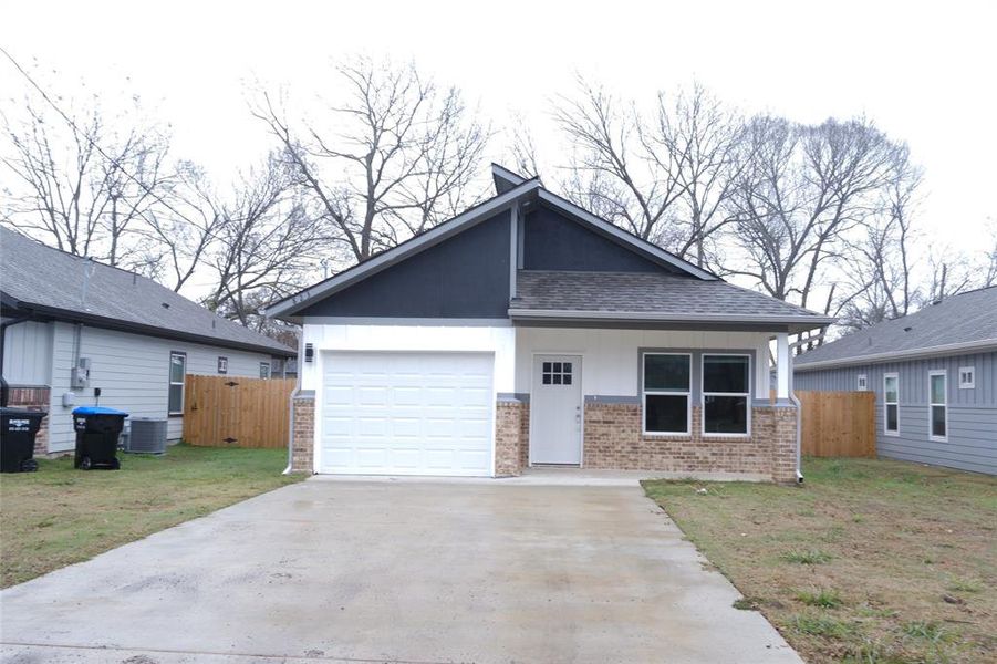 Front exterior of a new home in , Greenville, TX, highlighting curb appeal (Image 1). Front exterior of a new home in , Greenville, TX, highlighting curb appeal (Image 1).