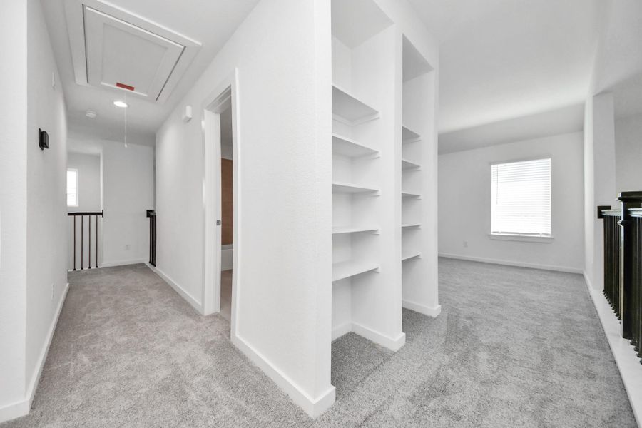 Come upstairs and enjoy a day of leisure in this fabulous game room! This is the perfect hangout spot or adult game room! Features plush carpet, high ceilings, custom paint and windows for plenty of natural light. Sample photo of completed home with similar floor plan. Actual colors and selections may vary.