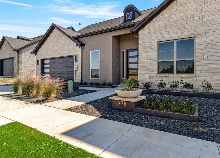 View of front of home featuring a garage