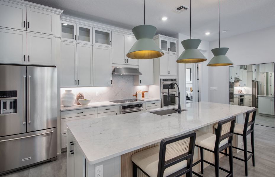 Representative furnished interior of a home built from the Ashby by DiVosta in Emerson Oaks, Vero Beach (Image 12).