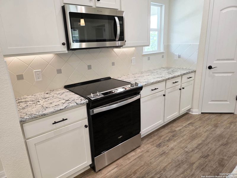 Furnished interior view inside a new home in , Fischer (Image 3).