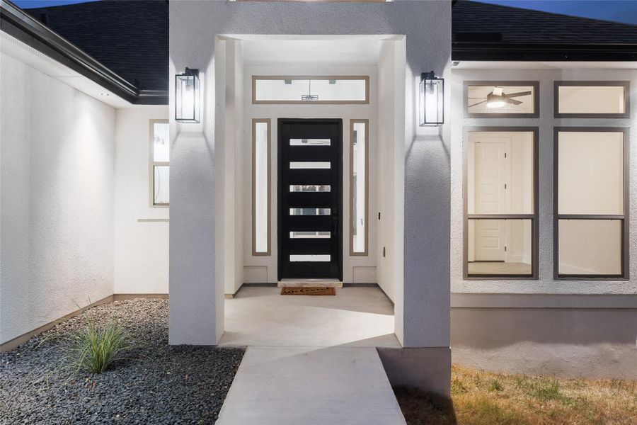 Property entrance with stucco siding