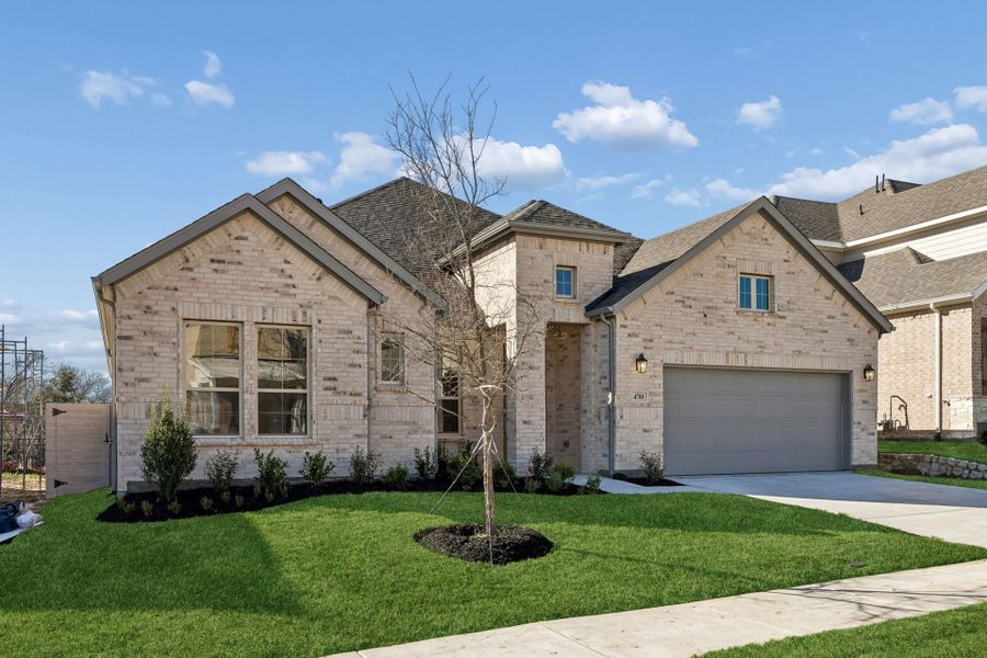 Front exterior of a new home in Painted Tree Lakeside, McKinney, TX, highlighting curb appeal (Image 2). Front exterior of a new home in Painted Tree Lakeside, McKinney, TX, highlighting curb appeal (Image 2).
