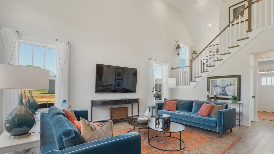 Memorable moments begin in this elegant, open family room with hardwood flooring and refined finishes in Woodruff, SC