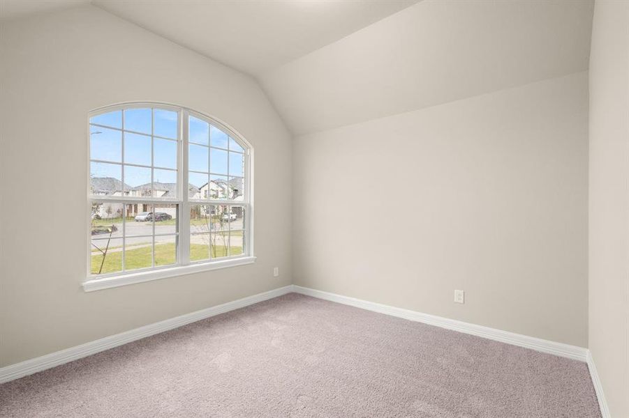 Your secondary bedroom features plush carpet, fresh paint, closet, and a large window that lets in plenty of natural lighting.