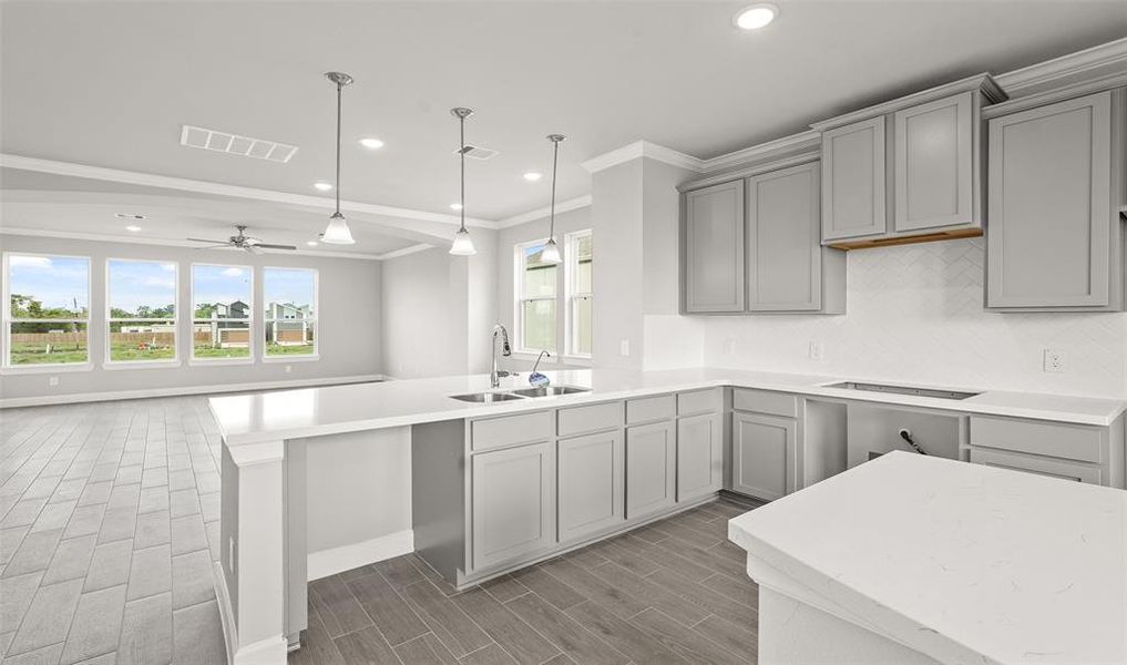 Kitchen overlooks dining room (*Photo not of actual home and used for illustration purposes only.)