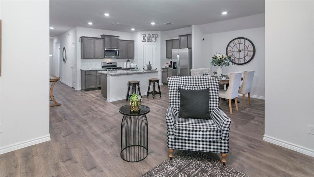 Living room with recessed lighting and dark wood-style flooring Living room with recessed lighting and dark wood-style flooring