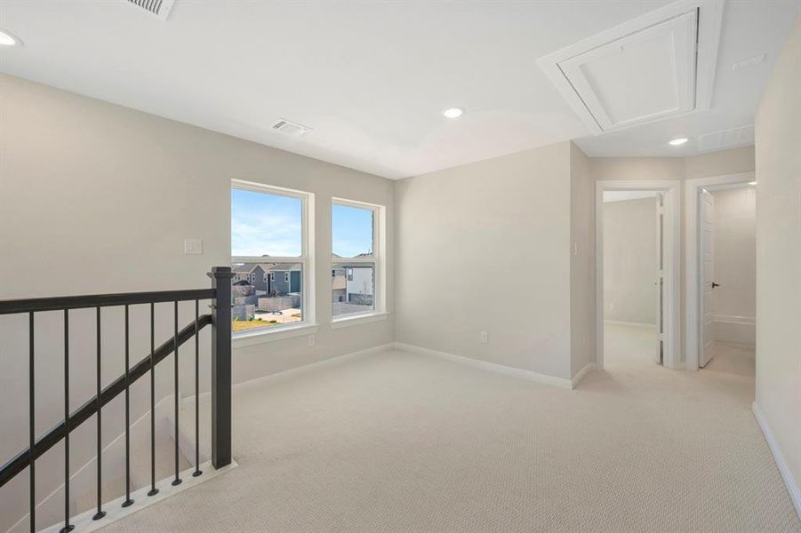 Unfurnished room with recessed lighting and carpet flooring