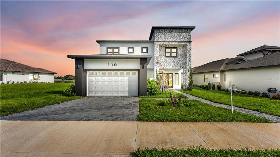 Front exterior of a new home in , Lake Alfred, FL, highlighting curb appeal (Image 27).