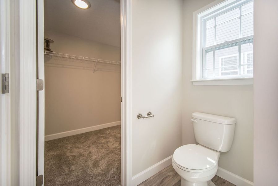 Representative furnished interior of a home built from the Quincy by Enchanted Homes in Hampshire Heights, Moore (Image 16).