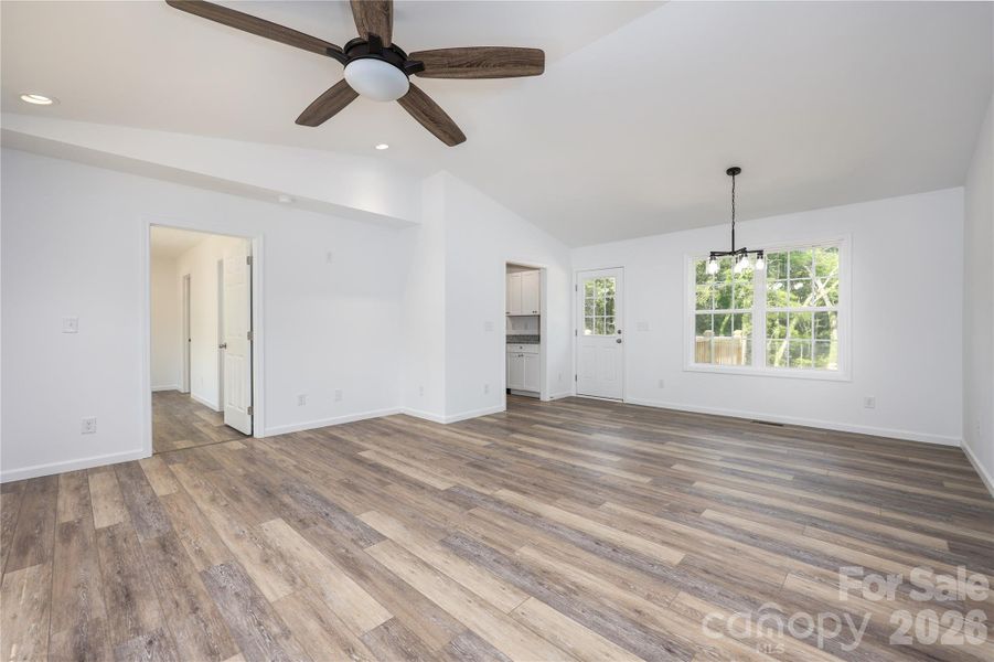 Living and dining area with door to back deck
