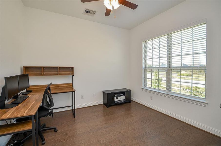 Wood floors and ceiling fan.