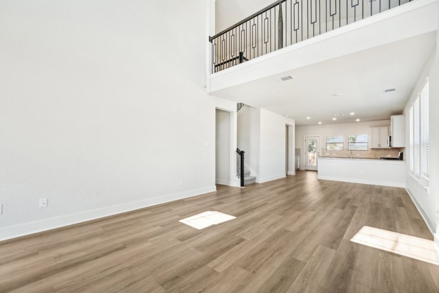 Living room and dining room in the Medina floorplan at a Meritage Homes community.