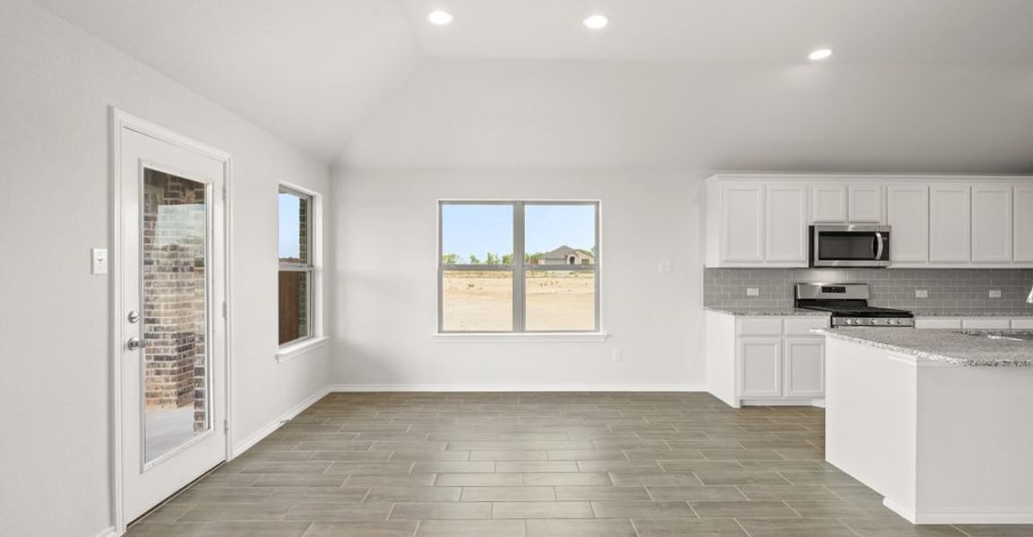 Representative exterior photo of a completed home built from the Atlanta by Impression Homes in Baker Farms, Cleburne, TX (Image 10). Representative exterior photo of a completed home built from the Atlanta by Impression Homes in Baker Farms, Cleburne, TX (Image 10).