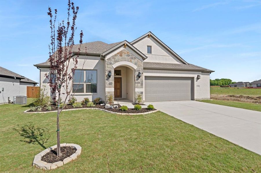 Front exterior of a new home in , Venus, TX, highlighting curb appeal (Image 20).