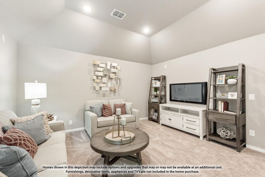 Living room with high ceilings, carpet flooring, sofa seating, and a TV entertainment center with open shelving Living room with high ceilings, carpet flooring, sofa seating, and a TV entertainment center with open shelving