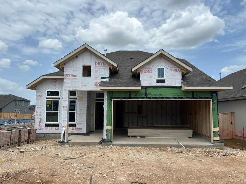Property under construction featuring a shingled roof Property under construction featuring a shingled roof