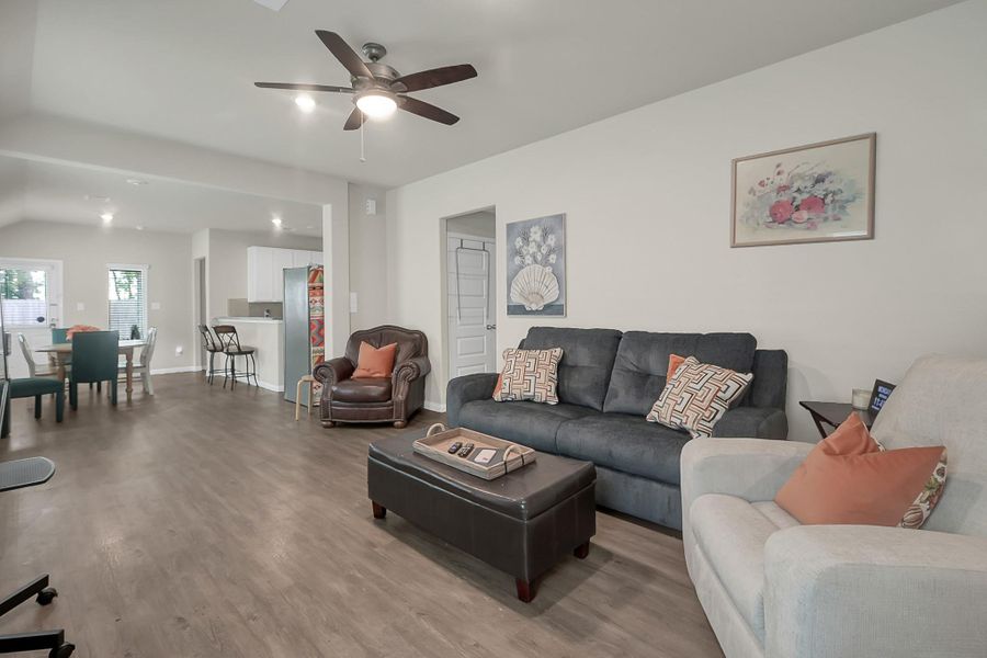 Spacious living room open to the dining with lots of natural lighting.