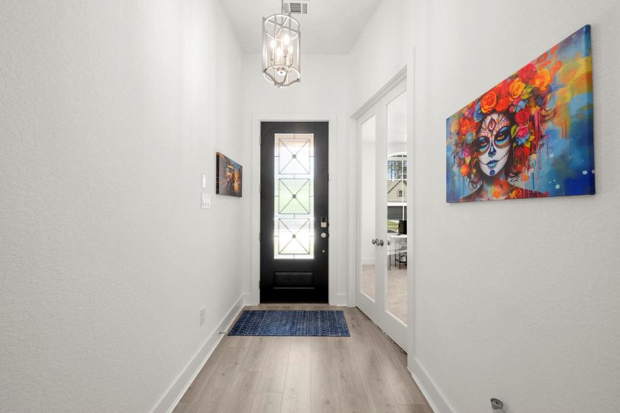 Looking out at the front door. Double door study to the right. Looking out at the front door. Double door study to the right.