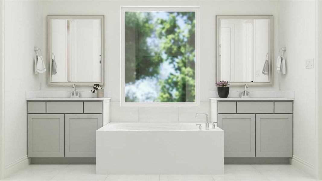 Bathroom with a tub to relax in, vanity, and tile patterned floors