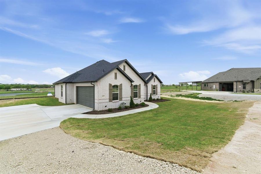 Front exterior of a new home in , Decatur, TX, highlighting curb appeal (Image 2). Front exterior of a new home in , Decatur, TX, highlighting curb appeal (Image 2).