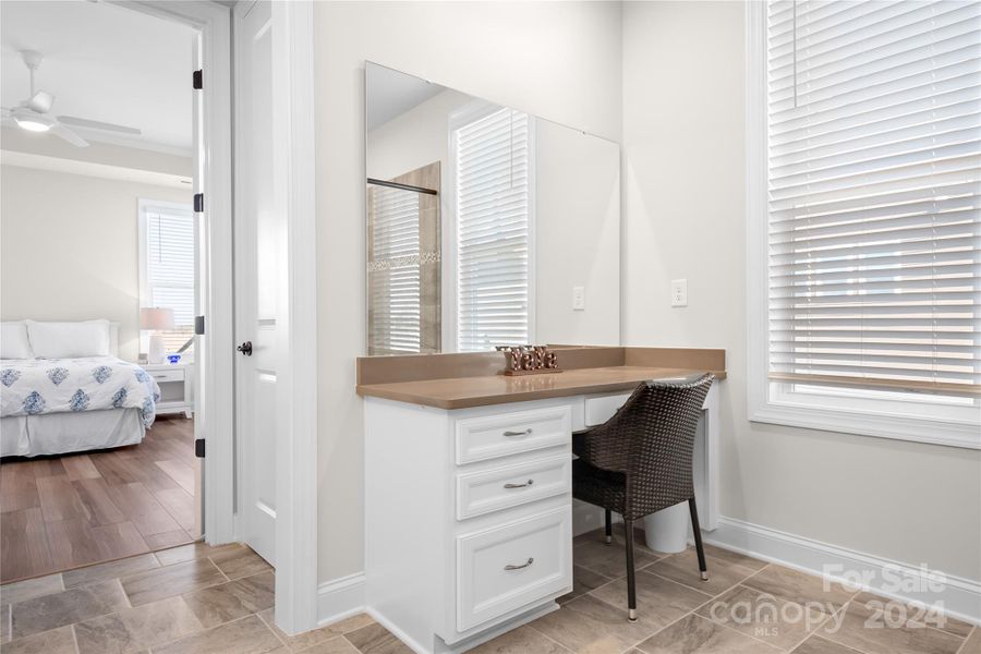 The Primary Ensuite Bathroom truly feels like a Spa and even has a separate make-up vanity with additional storage and quartz counters.