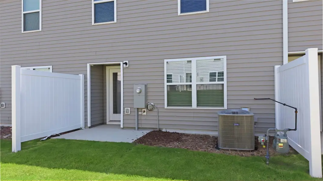 Exterior details and patio area of a home in The Townes at Hunter Hill, Rocky Mount (Image 3).