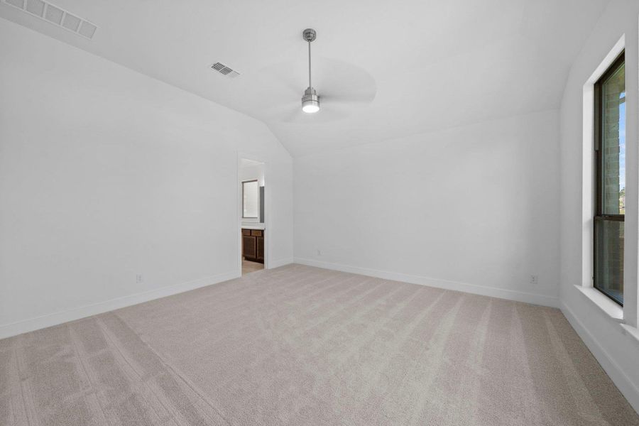 Primary Bedroom with elevated ceiling Primary Bedroom with elevated ceiling