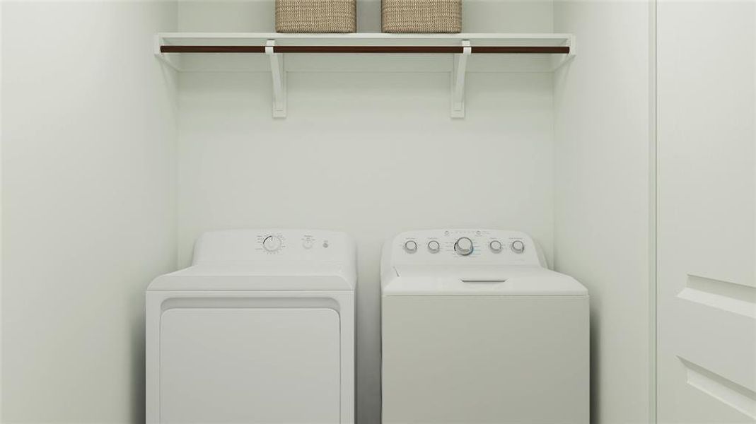 Laundry area featuring separate washer and dryer